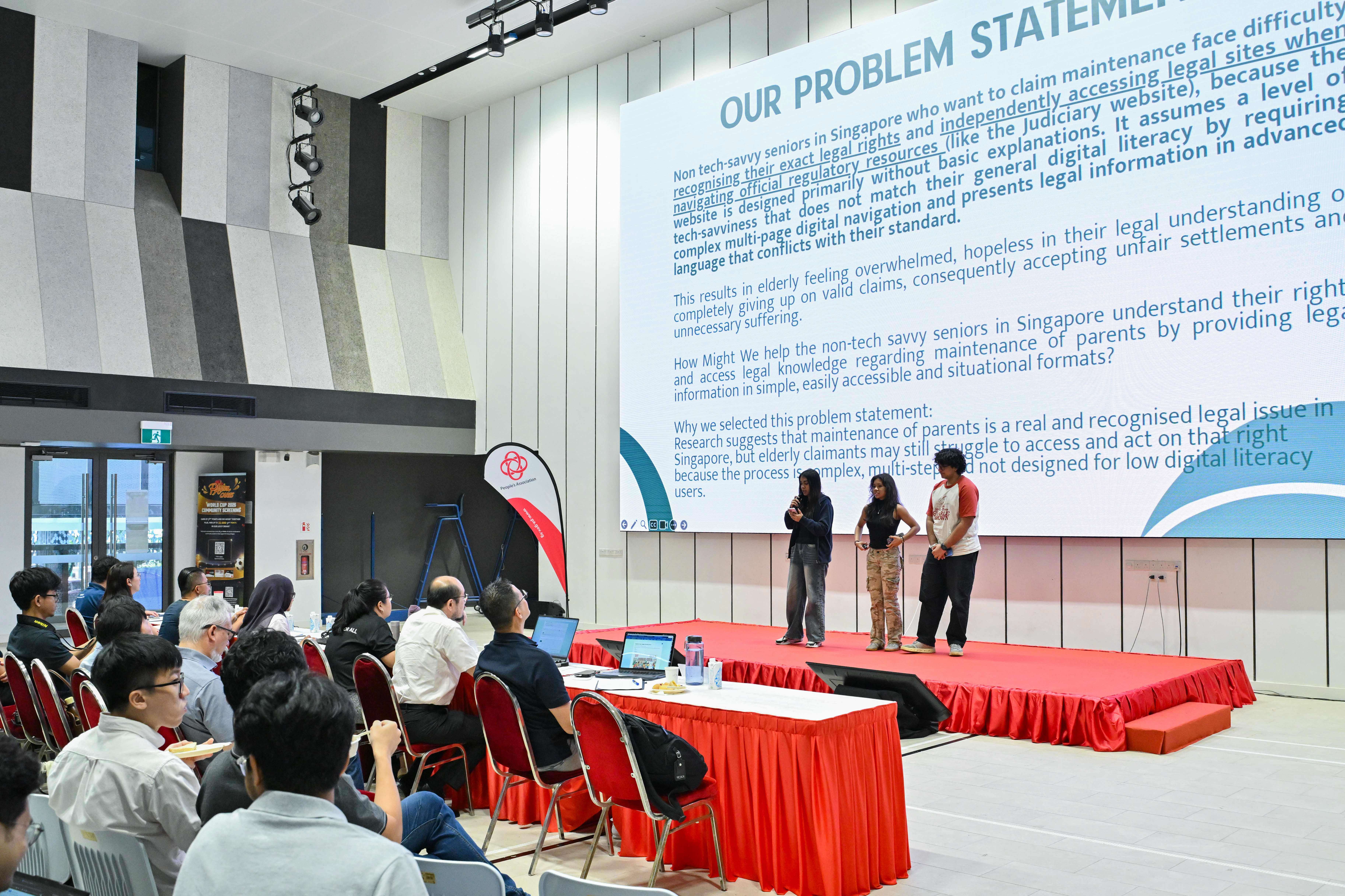 Three students explaining their problem statement to the panel